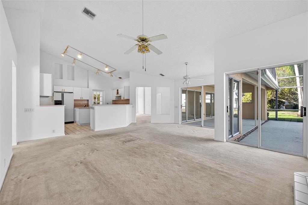 1819 Tree Swallow Way Palm Harbor, FL 34683 - Photo 13 of 37 a view of a kitchen with refrigerator and a sink