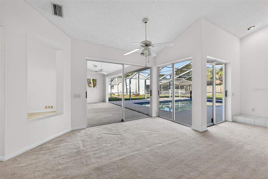 1819 Tree Swallow Way Palm Harbor, FL 34683 - Photo 15 of 37 a view of a livingroom with a furniture and chandelier