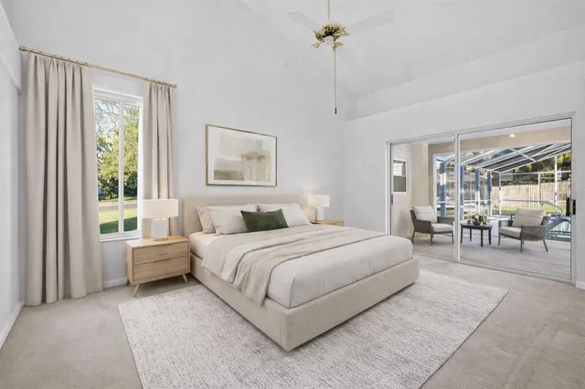 a bed room with a bed and a chandelier