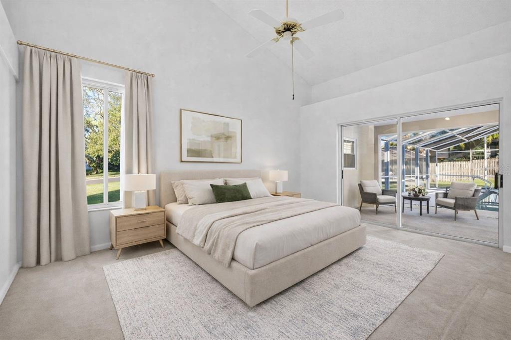 1819 Tree Swallow Way Palm Harbor, FL 34683 - Photo 16 of 37 a bed room with a bed and a chandelier