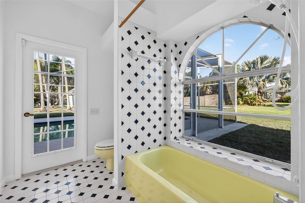 1819 Tree Swallow Way Palm Harbor, FL 34683 - Photo 26 of 37 a bathroom with a bathtub and a shower