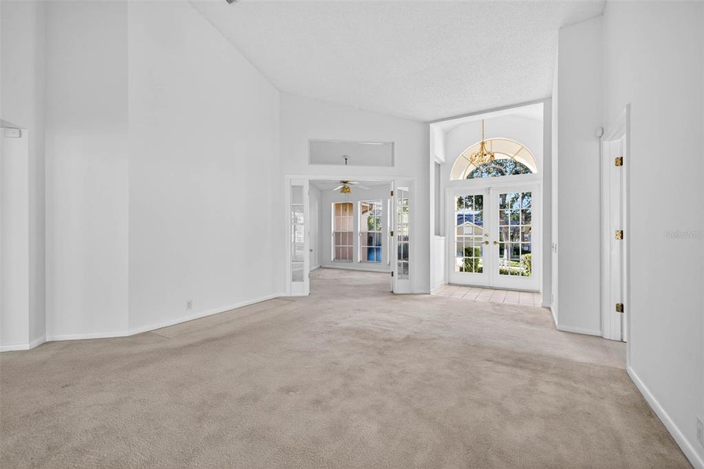 1819 Tree Swallow Way Palm Harbor, FL 34683 - Photo 3 of 37 an empty room with windows