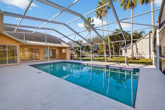a view of a swimming pool with a patio