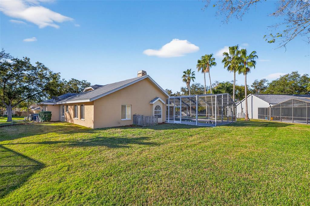 1819 Tree Swallow Way Palm Harbor, FL 34683 - Photo 33 of 37 a house view with a garden space