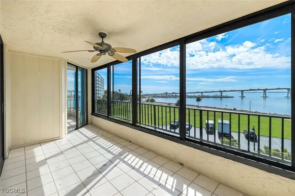 a view of a balcony with furniture