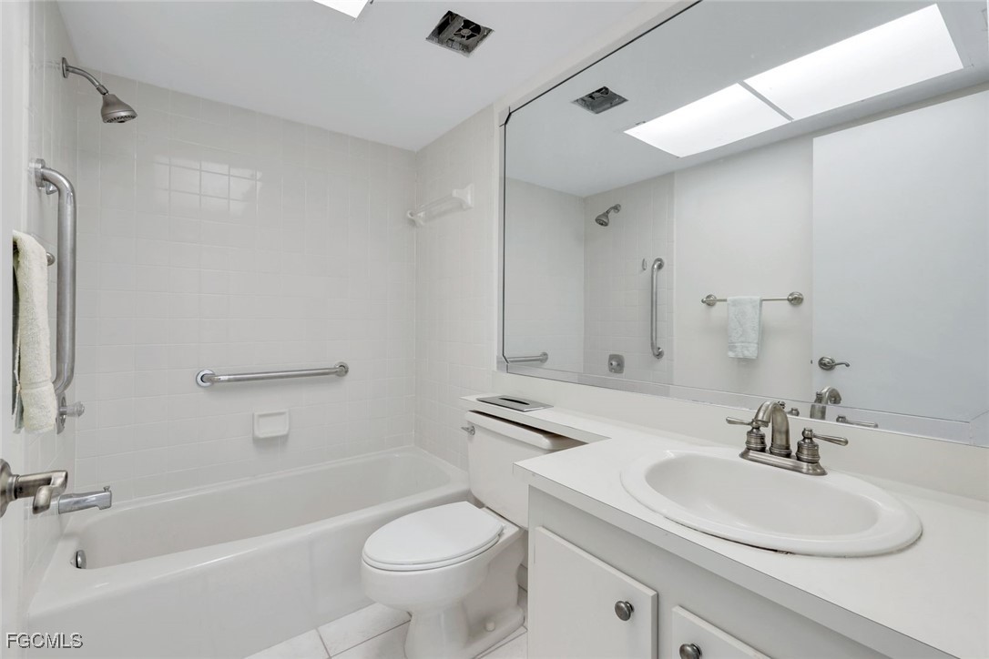 15010 Punta Rassa Road, Unit 305 Fort Myers, FL 33908 - Photo 18 of 21 a bathroom with a sink toilet and shower