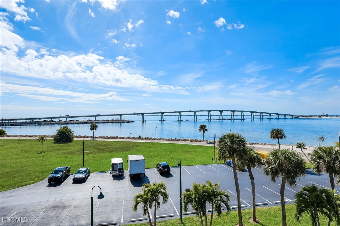 15010 Punta Rassa Road, Unit 305 Fort Myers, FL 33908 - Photo 20 of 21 a view of a swimming pool and lake view