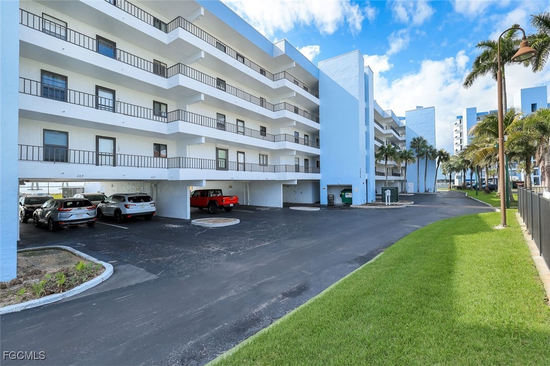 15010 Punta Rassa Road, Unit 305 Fort Myers, FL 33908 - Photo 2 of 21 a car parked in front of a building