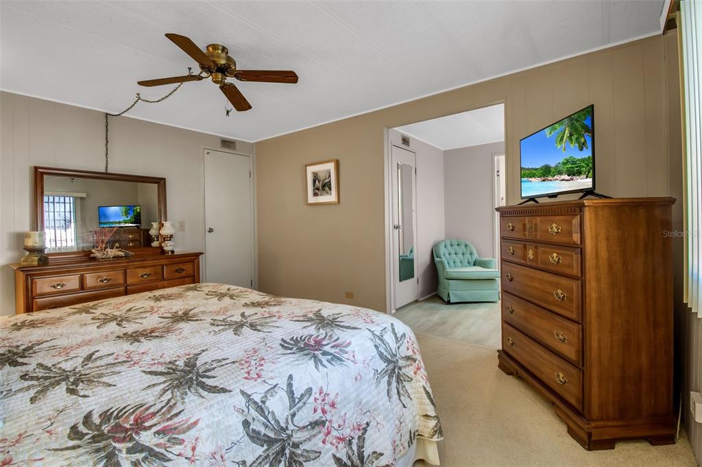 5619 Bayshore Road, Unit 160 Palmetto, FL 34221 - Photo 13 of 30 a bedroom with a bed and a flat screen tv