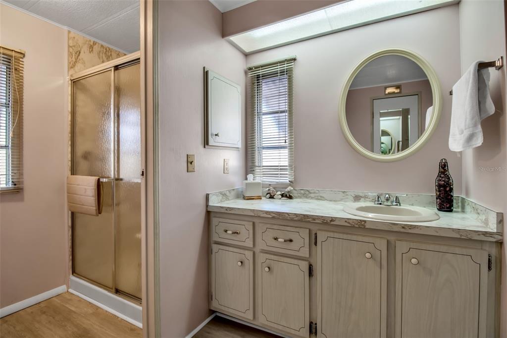 5619 Bayshore Road, Unit 160 Palmetto, FL 34221 - Photo 16 of 30 a bathroom with a double vanity sink and a mirror