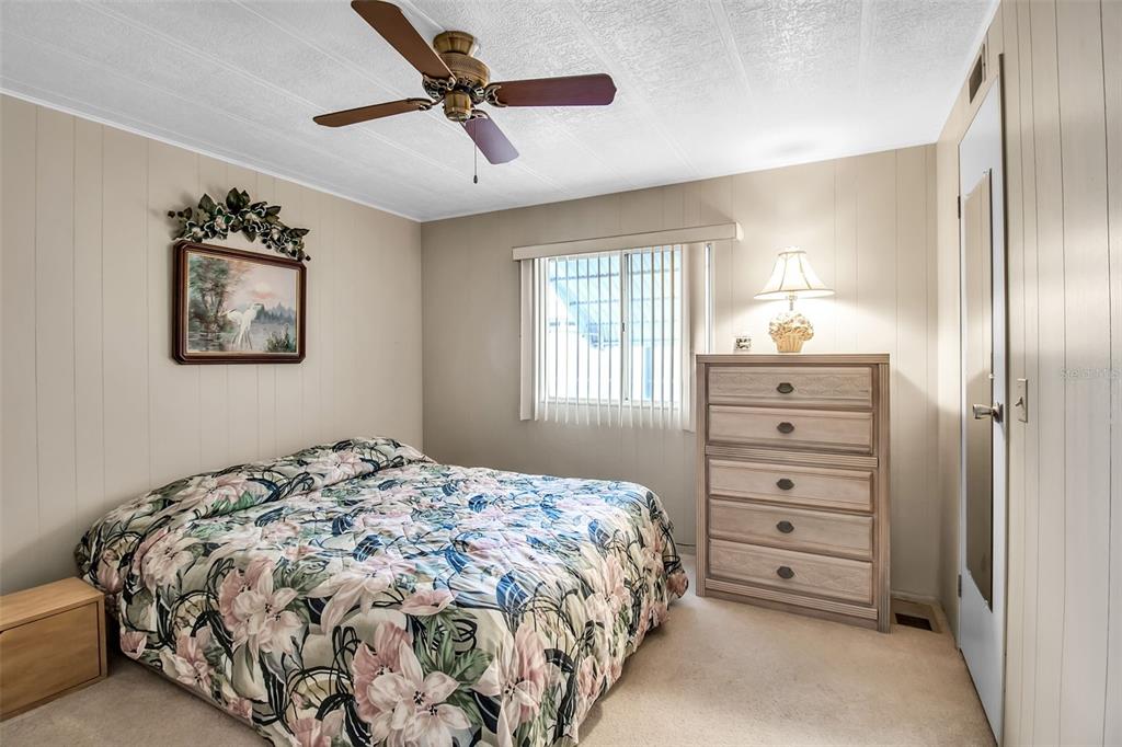 5619 Bayshore Road, Unit 160 Palmetto, FL 34221 - Photo 18 of 30 a bedroom with a bed and a window