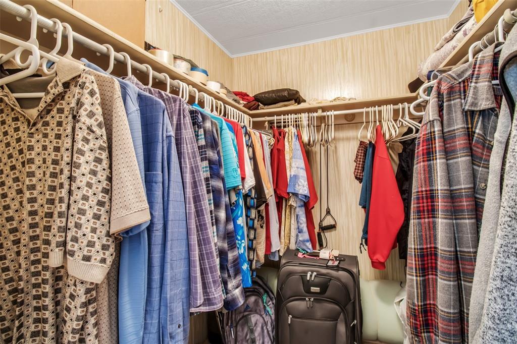 5619 Bayshore Road, Unit 160 Palmetto, FL 34221 - Photo 20 of 30 a view of walk in closet with clothes