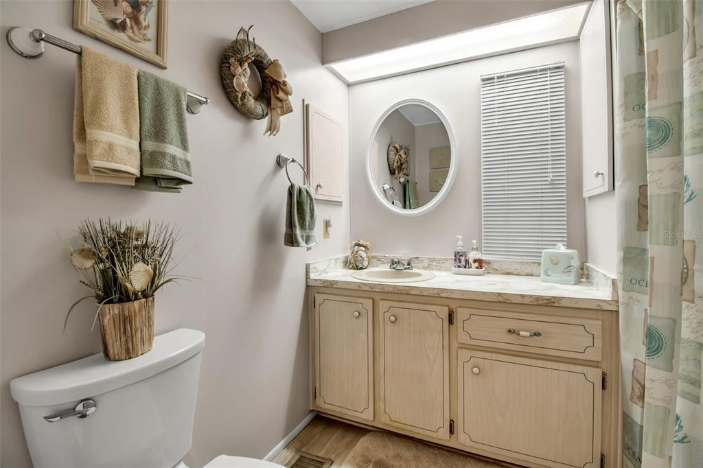 5619 Bayshore Road, Unit 160 Palmetto, FL 34221 - Photo 21 of 30 a bathroom with a toilet sink and mirror