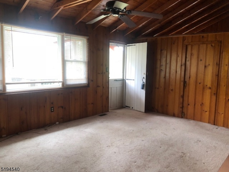 208 Pohatcong Road Vernon, NJ 07422 - Photo 14 of 15 an empty room with windows