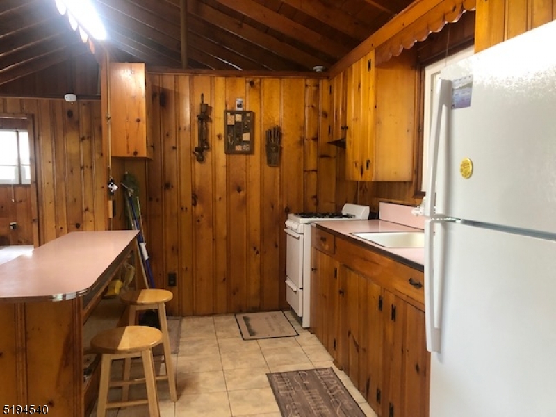 208 Pohatcong Road Vernon, NJ 07422 - Photo 5 of 15 a bathroom with a sink and a mirror