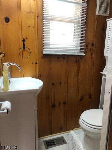 208 Pohatcong Road Vernon, NJ 07422 - Photo 8 of 15 a bathroom with a sink a toilet and shower