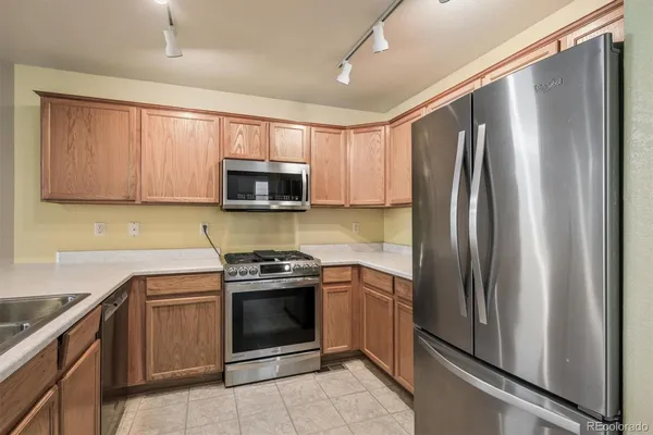 a kitchen with a stove microwave and refrigerator