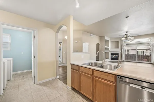 a kitchen with a sink and refrigerator
