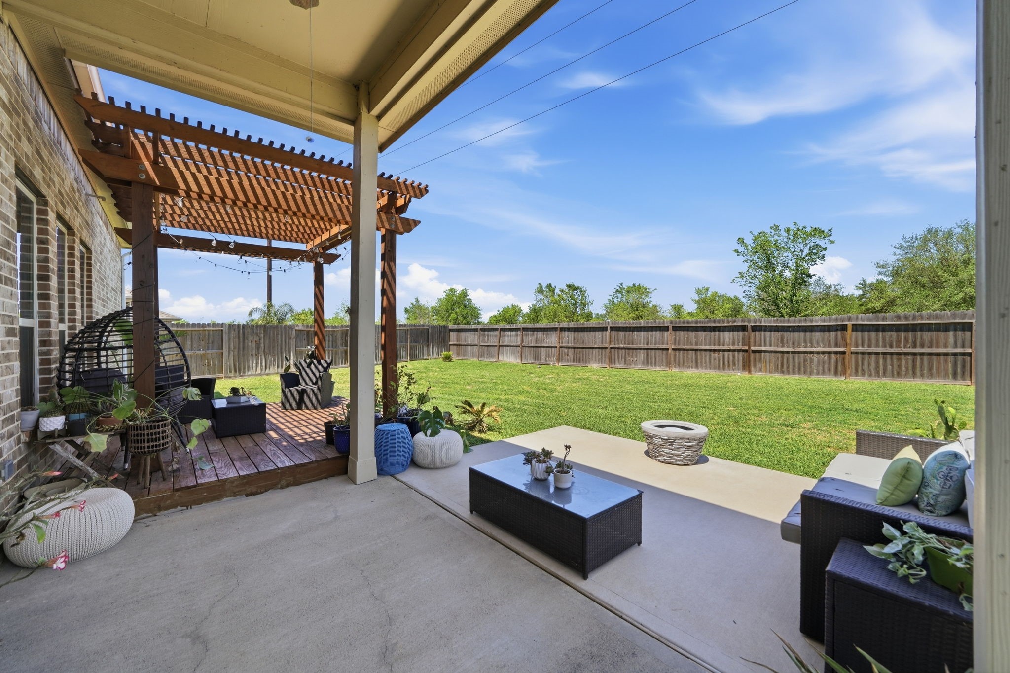 13207 Alcott Forest Lane Rosharon, TX 77583 - Photo 3 of 44 Step outside to this huge backyard. No neighbors behind the residence! Separate lounge areas and a fire pit.