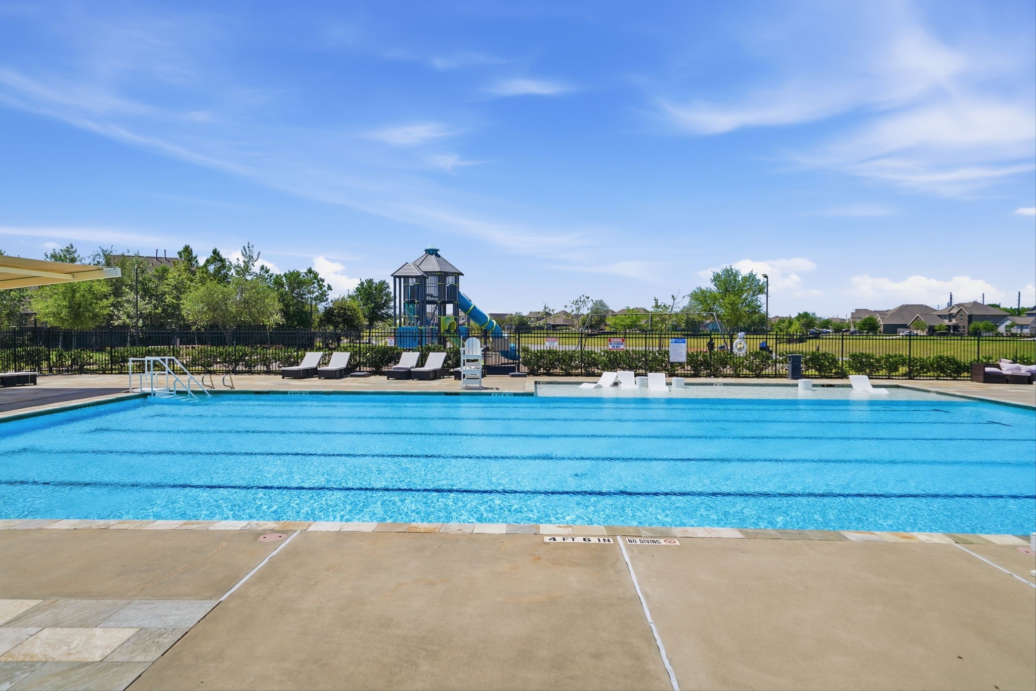 13207 Alcott Forest Lane Rosharon, TX 77583 - Photo 5 of 44 The Lakes of Savannah offers several pool areas and a splash pad.