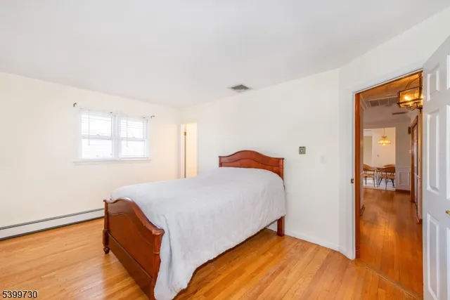 a bed room with a bed and a window