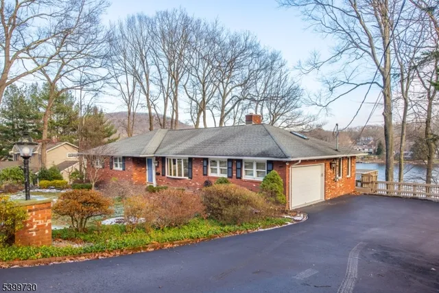 a front view of a house with a yard and a garage