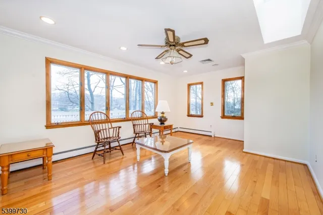 a view of a livingroom with furniture and a window