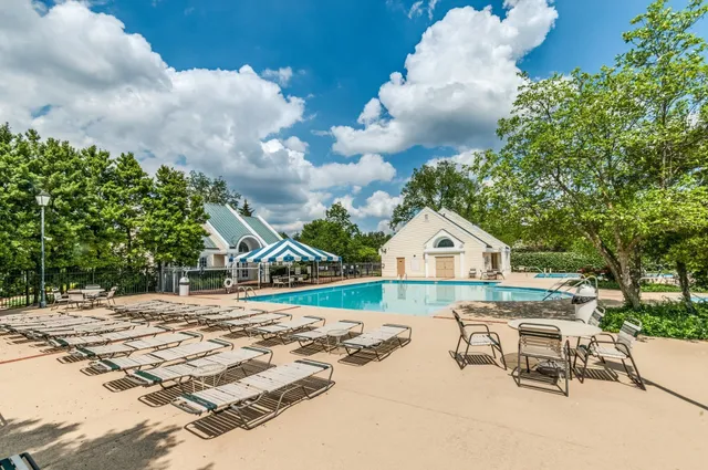 a view of house with yard and entertaining space