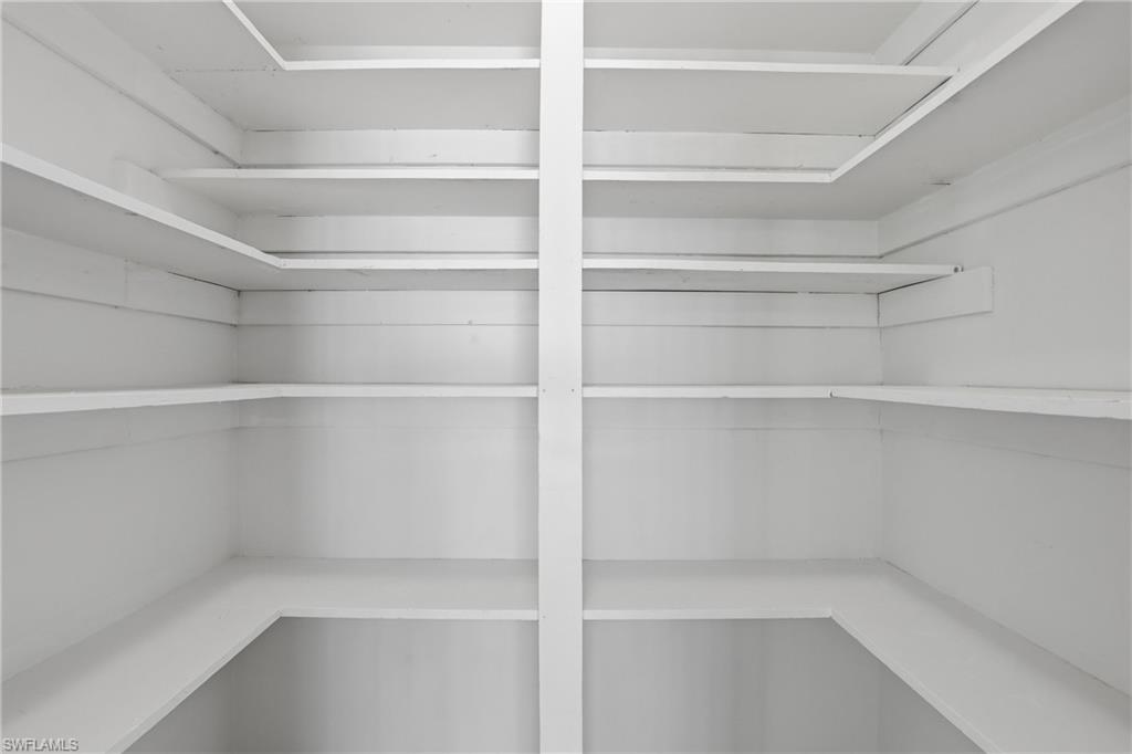 135 Pebble Beach Boulevard Naples, FL 34113 - Photo 13 of 37 a view of walk in closet with empty racks