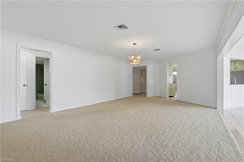 135 Pebble Beach Boulevard Naples, FL 34113 - Photo 15 of 37 a view of an empty room