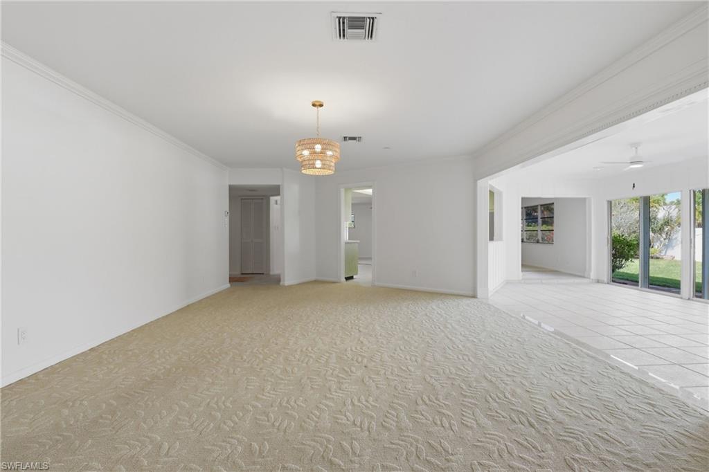 135 Pebble Beach Boulevard Naples, FL 34113 - Photo 25 of 37 an empty room with window and pillar in it