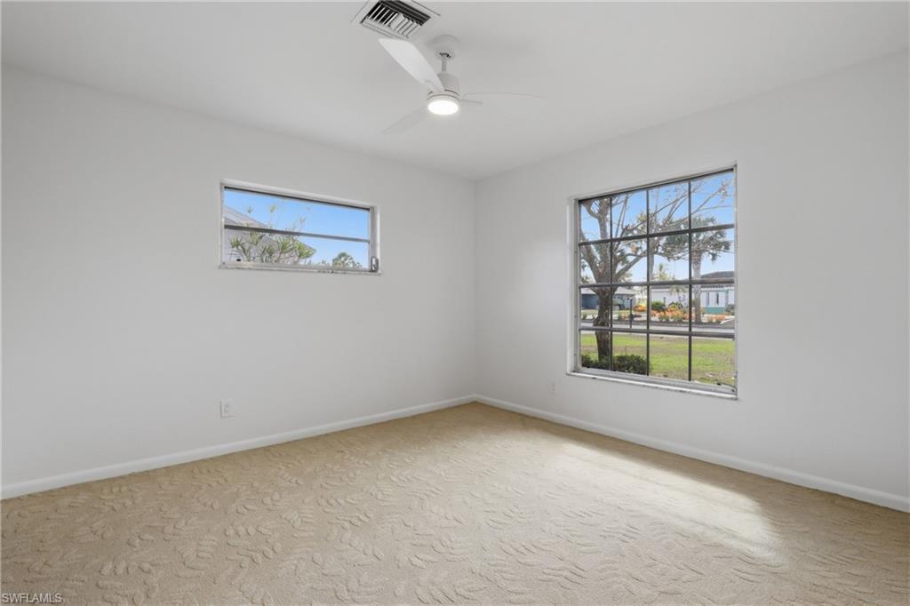 135 Pebble Beach Boulevard Naples, FL 34113 - Photo 27 of 37 an empty room with windows and closet