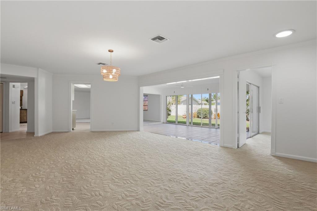 135 Pebble Beach Boulevard Naples, FL 34113 - Photo 28 of 37 a view of a room with large windows