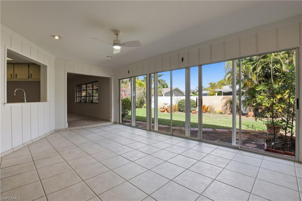 135 Pebble Beach Boulevard Naples, FL 34113 - Photo 29 of 37 a view of empty room with wooden floor and fan