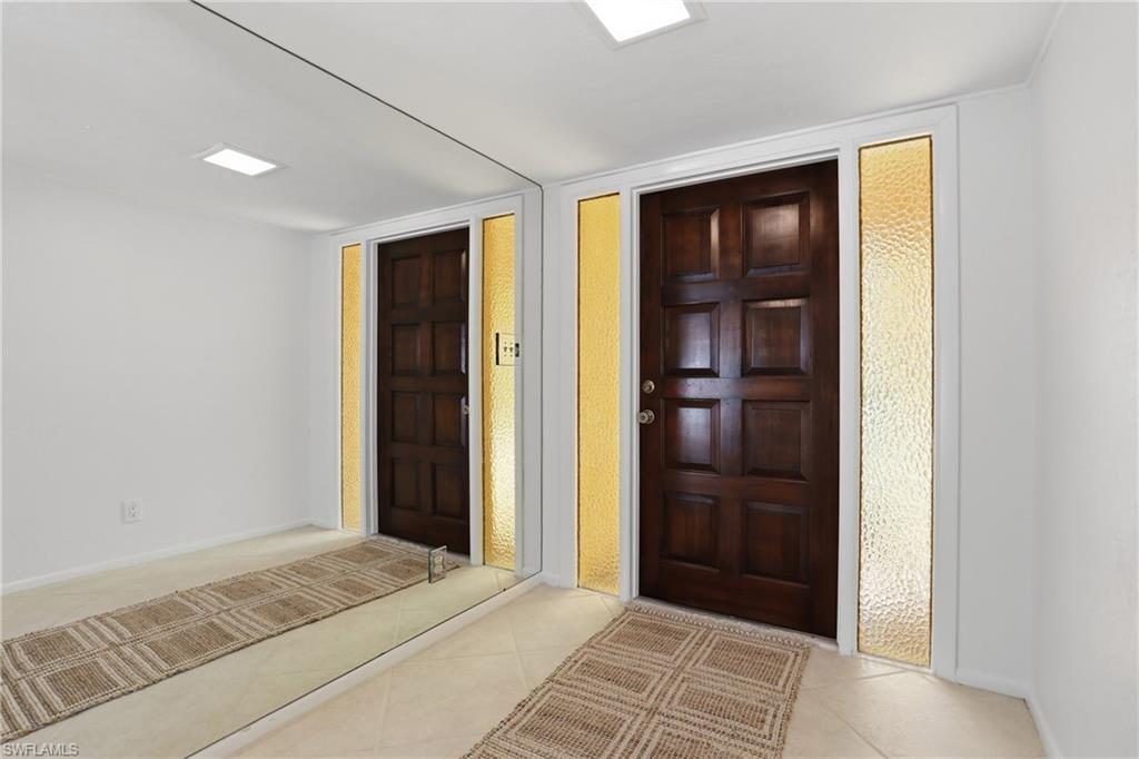 135 Pebble Beach Boulevard Naples, FL 34113 - Photo 3 of 37 a view of an entryway of house