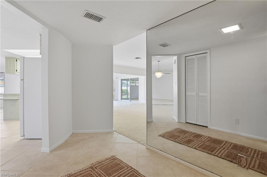 135 Pebble Beach Boulevard Naples, FL 34113 - Photo 4 of 37 a bathroom with a shower