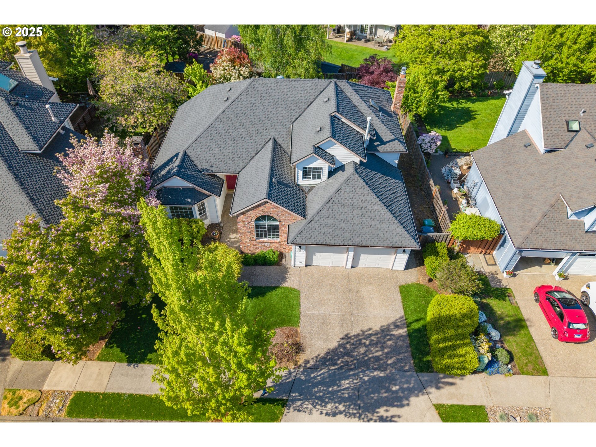 5393 Southwest Wichita Street Tualatin, OR 97062 - Photo 1 of 45 a aerial view of a house with a yard and potted plants
