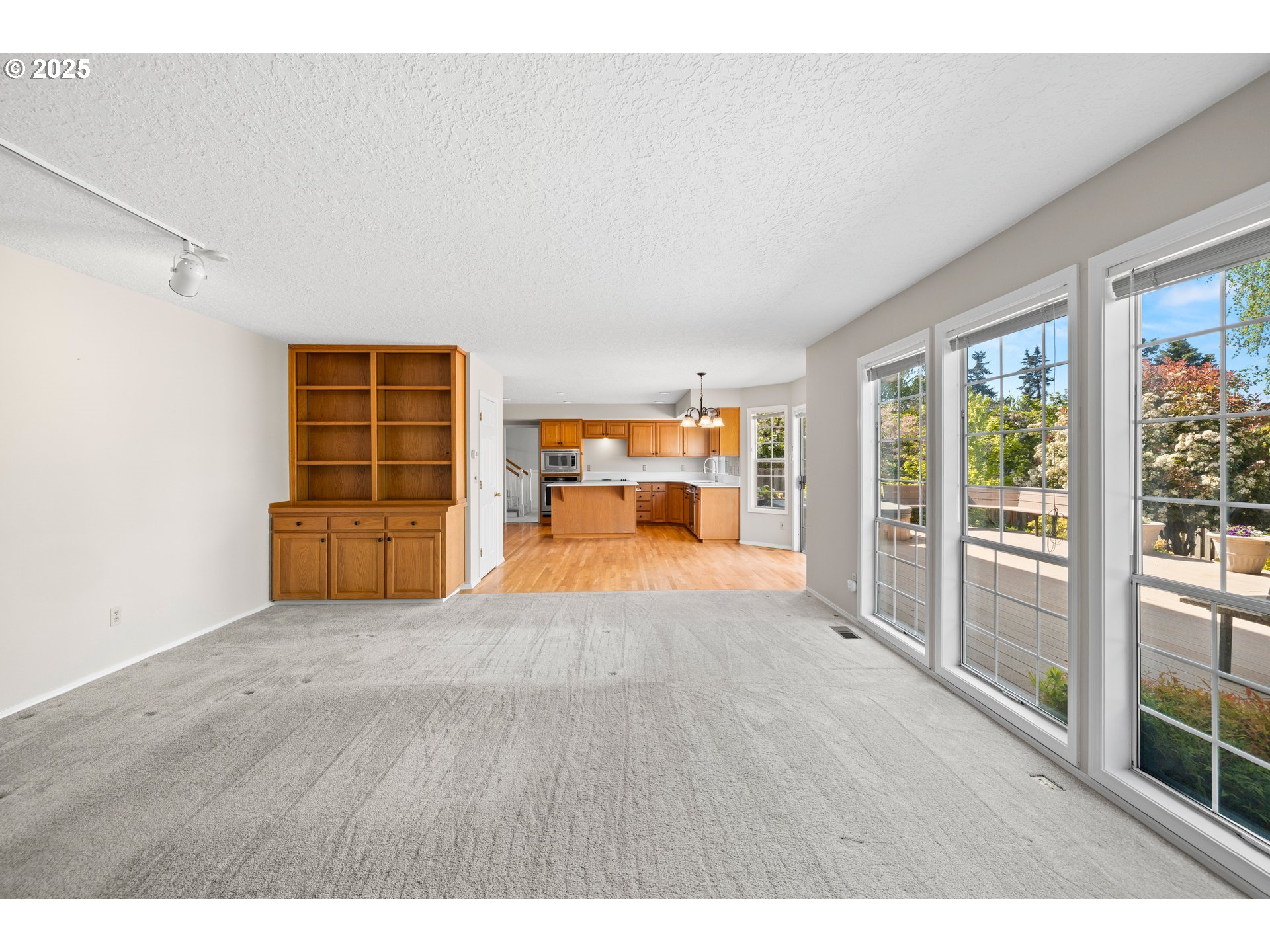 5393 Southwest Wichita Street Tualatin, OR 97062 - Photo 22 of 45 a view of empty room with wooden floor and fan