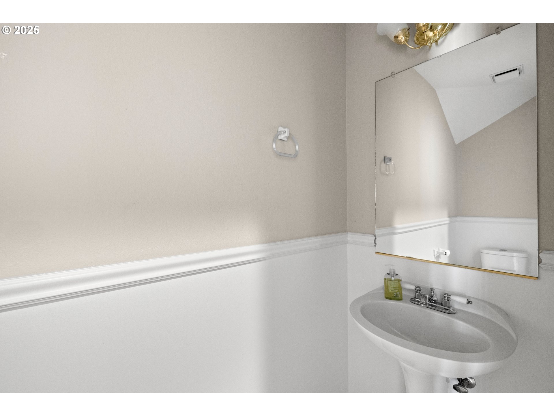 5393 Southwest Wichita Street Tualatin, OR 97062 - Photo 23 of 45 a bathroom with a sink and a mirror