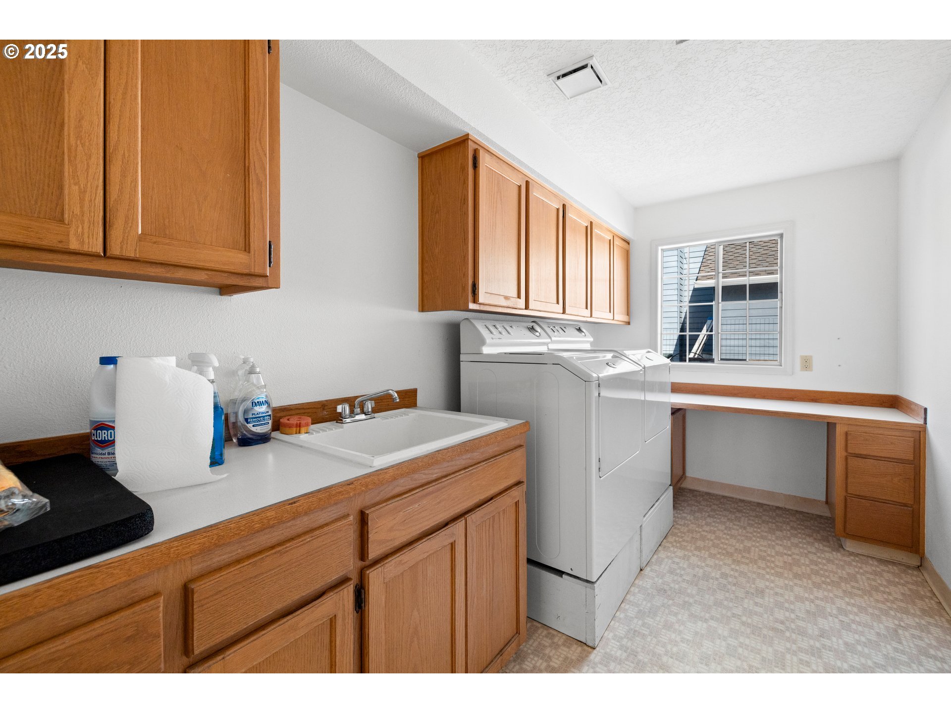 5393 Southwest Wichita Street Tualatin, OR 97062 - Photo 25 of 45 a utility room with cabinets washer and dryer