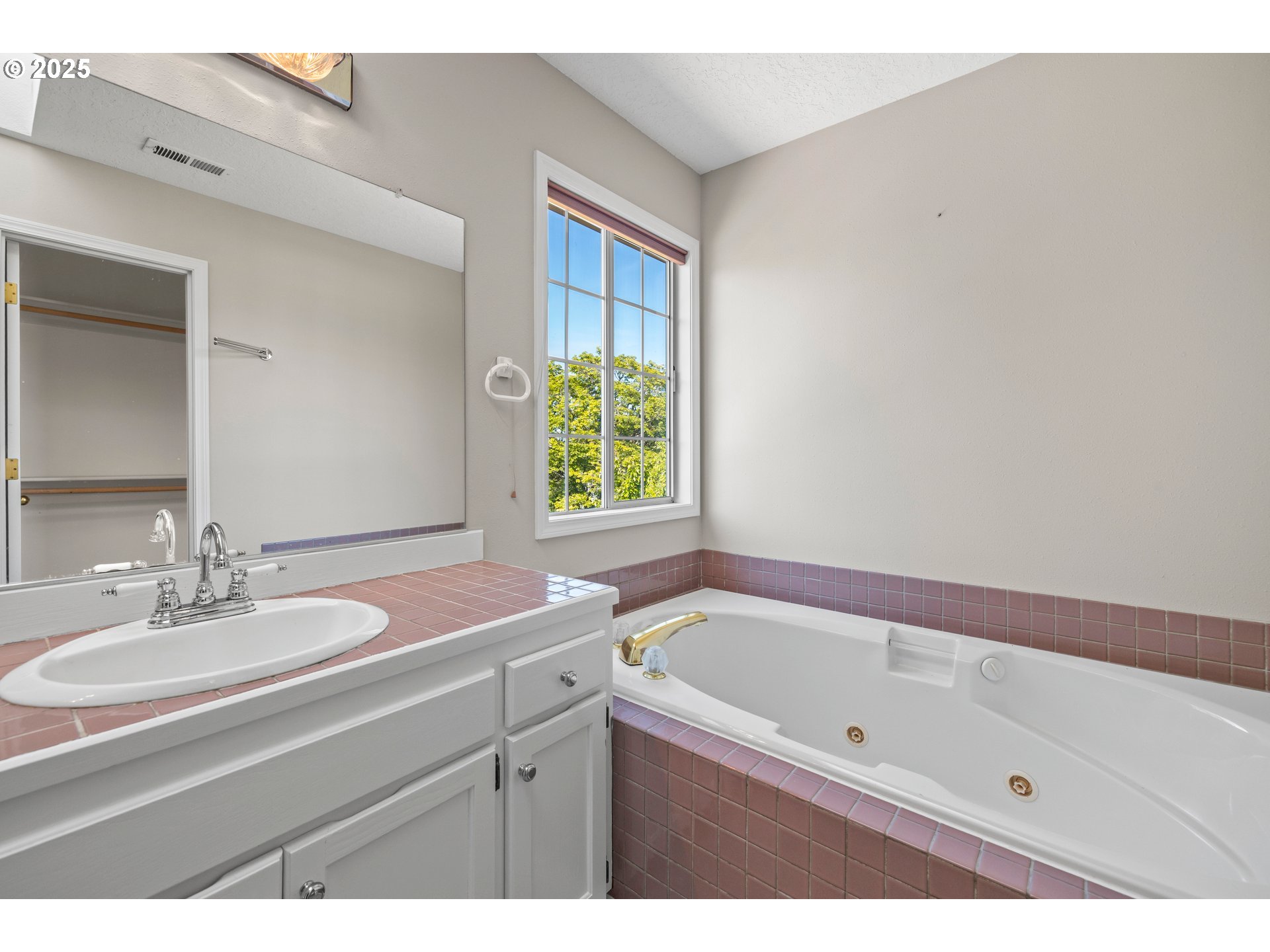 5393 Southwest Wichita Street Tualatin, OR 97062 - Photo 32 of 45 a bathroom with a sink and a bathtub