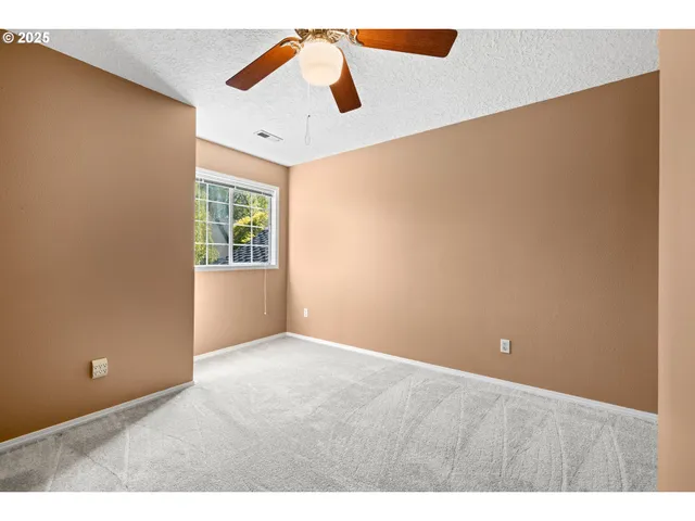 view of an empty room with a window