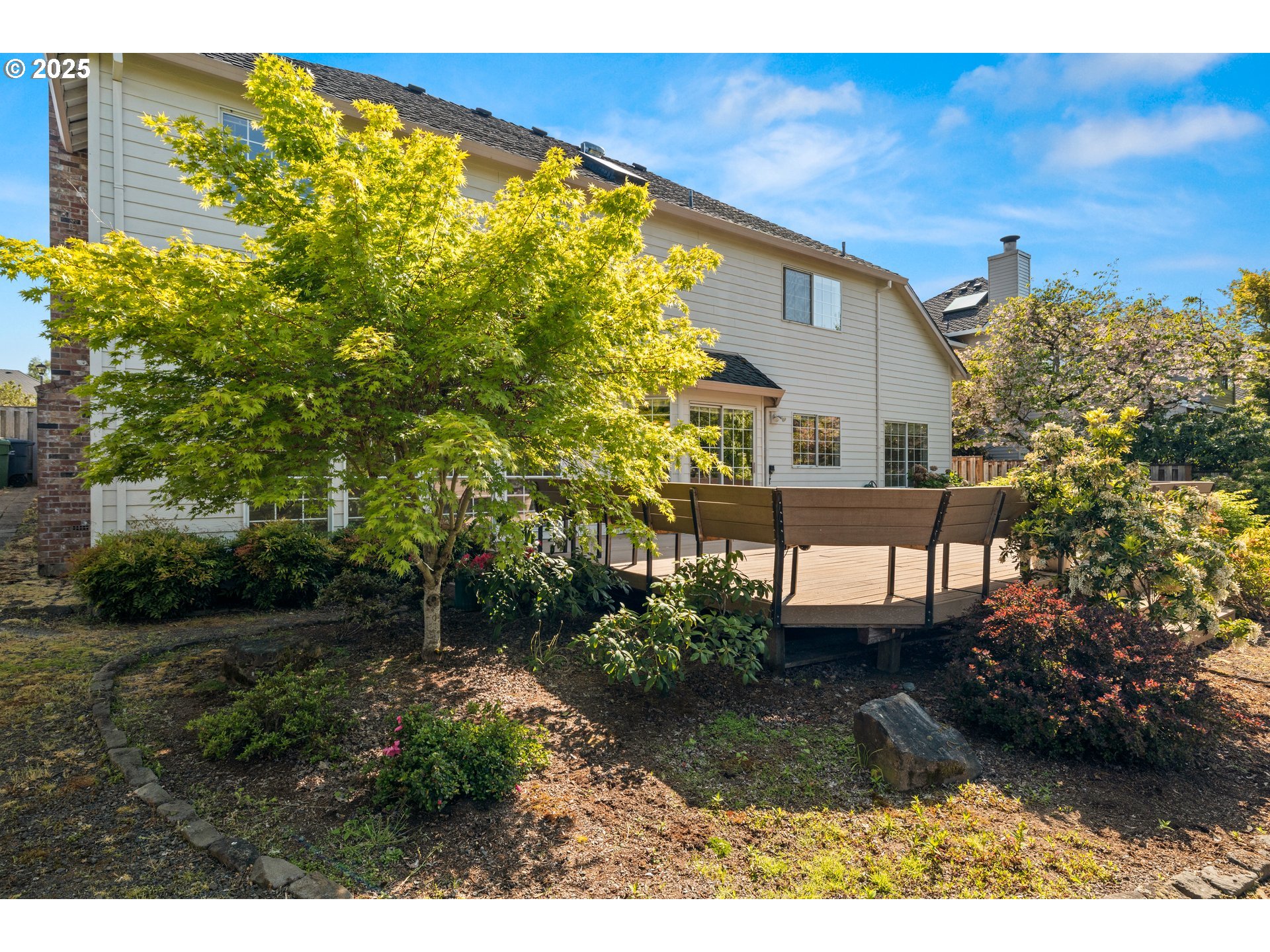 5393 Southwest Wichita Street Tualatin, OR 97062 - Photo 39 of 45 a view of a house with a yard