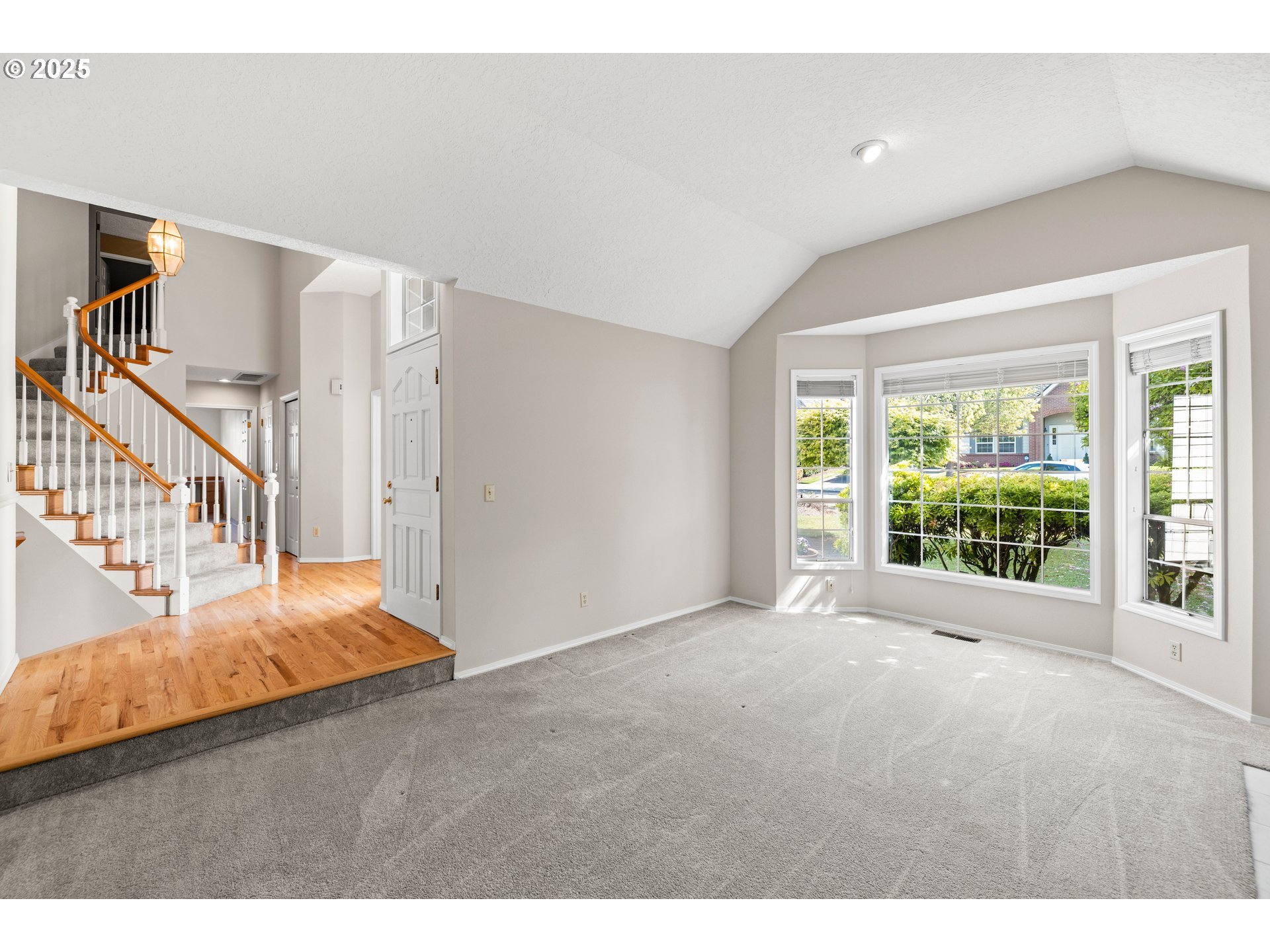 5393 Southwest Wichita Street Tualatin, OR 97062 - Photo 9 of 45 a backyard of a house with wooden floor and windows