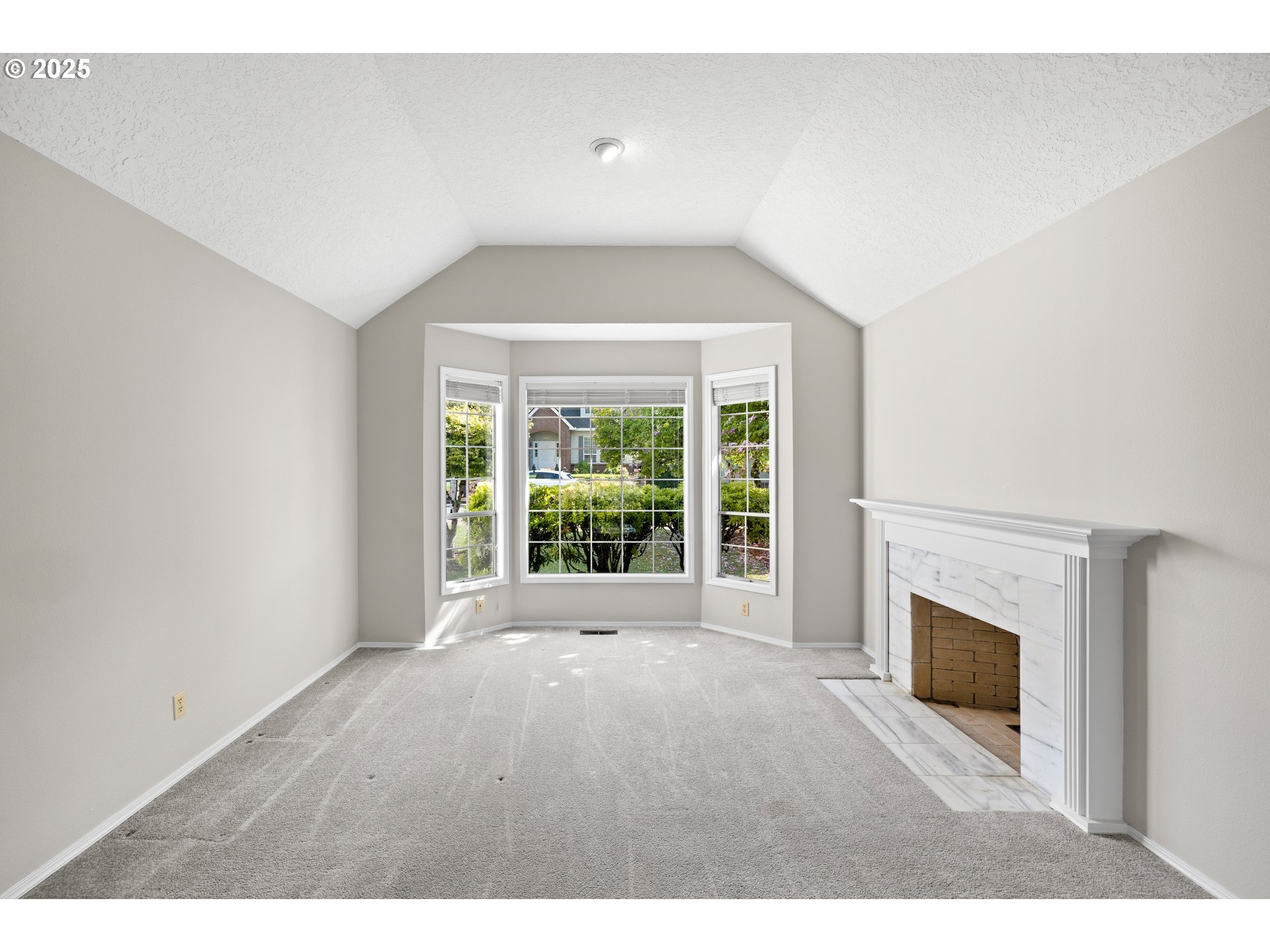 5393 Southwest Wichita Street Tualatin, OR 97062 - Photo 10 of 45 a view of empty room with a fireplace