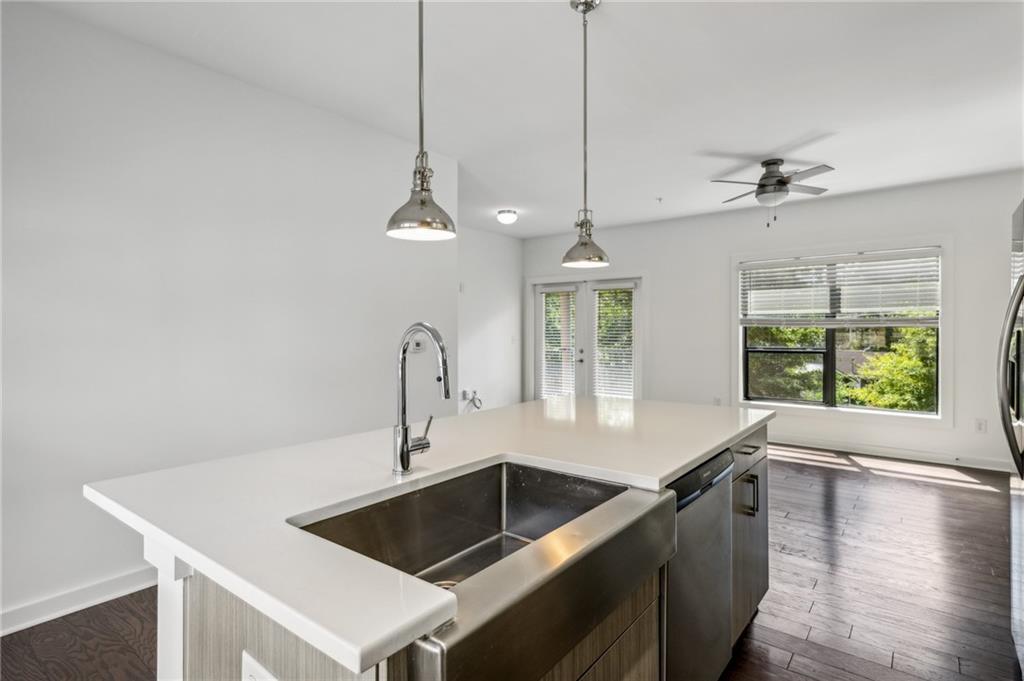 36 Moda Lane Atlanta, GA 30307 - Photo 11 of 26 a kitchen with a sink a counter and chairs