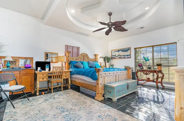 a bed room with furniture and a chandelier