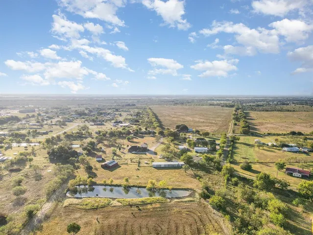 an aerial view of residential building with ocean view