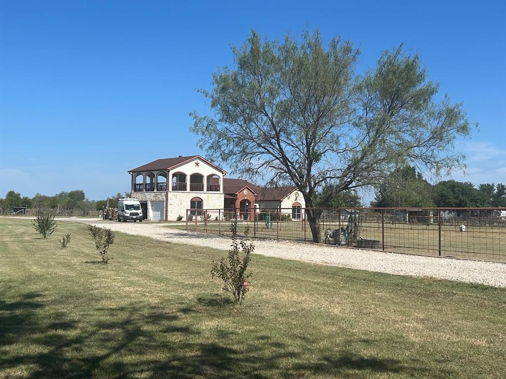 6524 Fair Road Kaufman, TX 75142 - Photo 31 of 33 a view of a lake with a house in the background