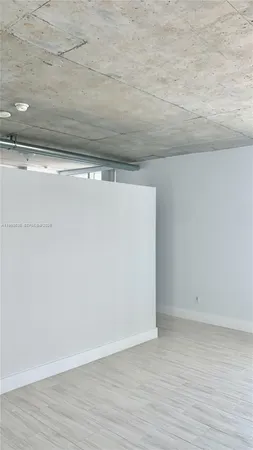 a view of small space with wooden floor